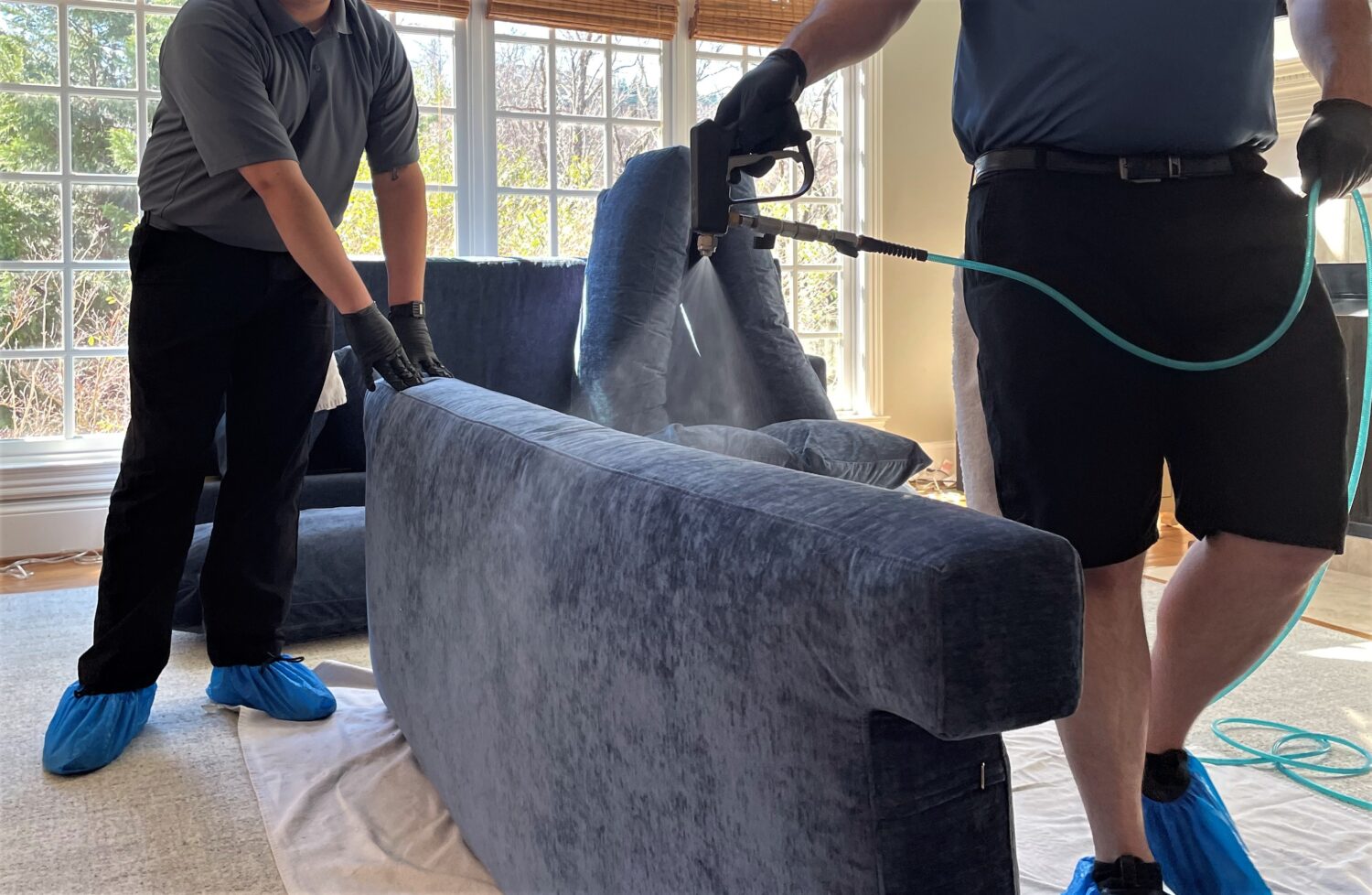 Pro-Care Technicians partner to protect sofa.