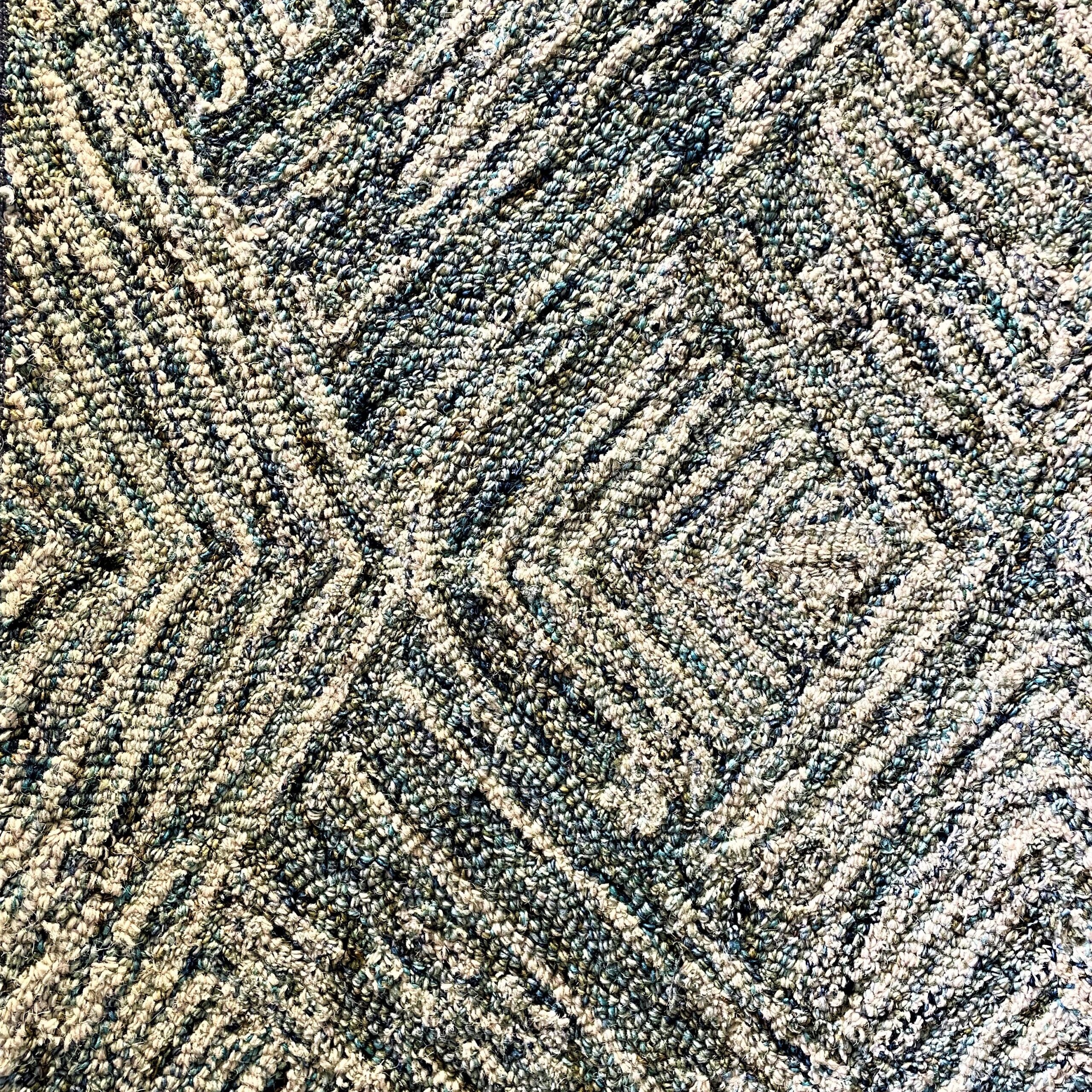 Multi-colored carpet with raised pattern