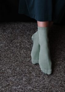 Feet on dark carpet