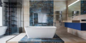 In 2024, tile-wrapping or wall to floor installation is one of the newest trends in tile and makes for a stunning focal point in a contemporary bathroom.