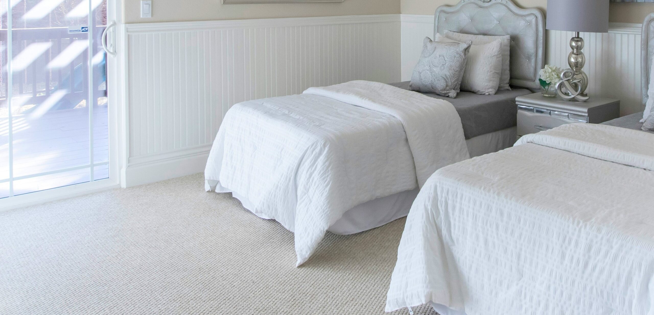 Light neutral carpet is on trend and a great choice for cozy bedrooms.